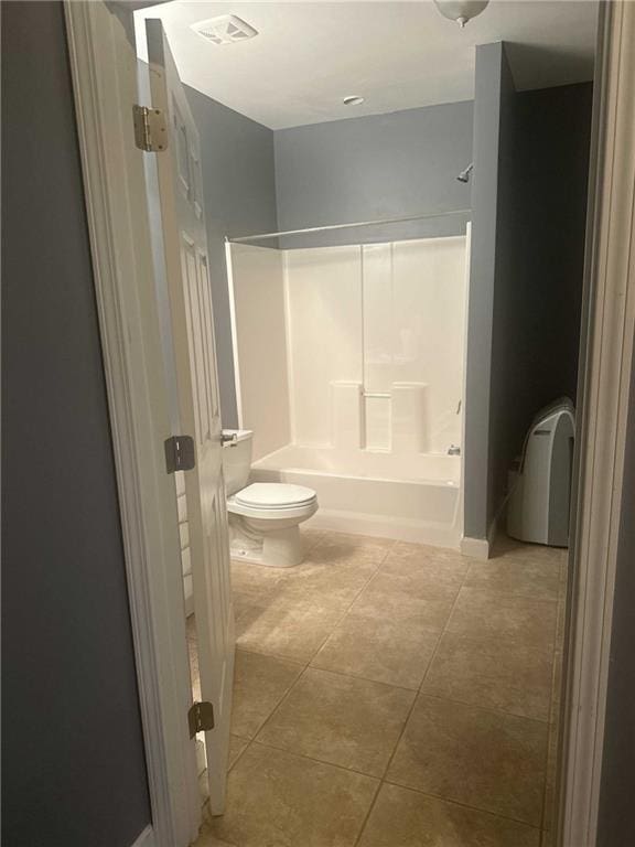 full bath with toilet, bathing tub / shower combination, tile patterned flooring, and visible vents