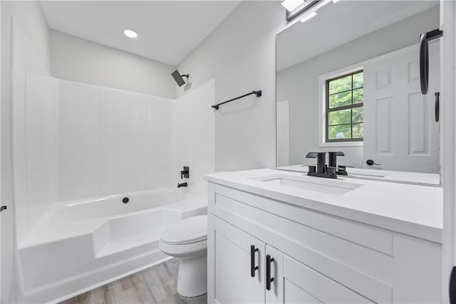 2246 Hightrail Ct, Lithonia, GA 30058 - full bathroom featuring vanity, washtub / shower combination, wood finished floors, and recessed lighting
