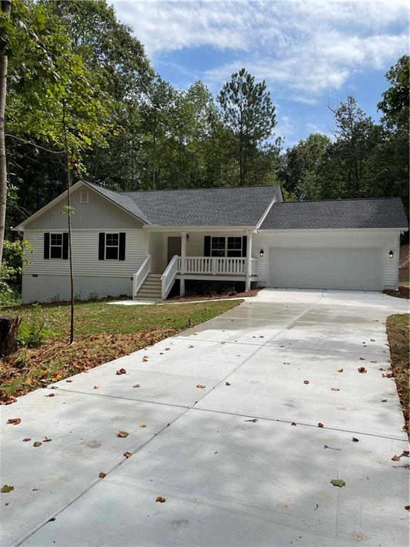 single story home featuring a garage