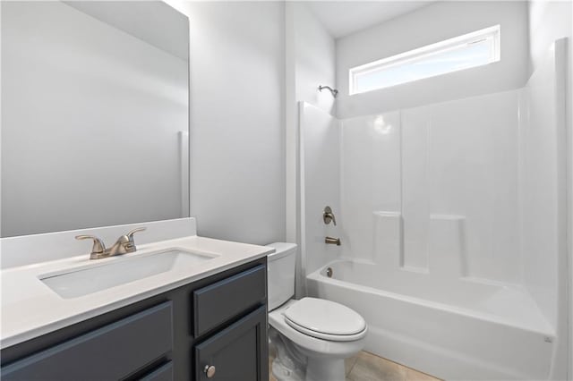 full bathroom with tub / shower combination, tile patterned floors, vanity, and toilet