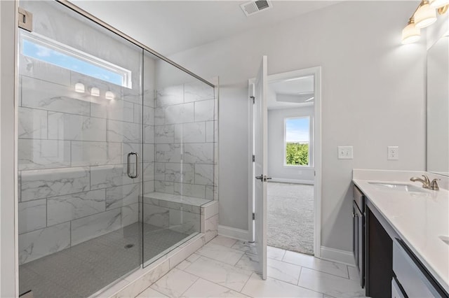 bathroom with vanity and an enclosed shower