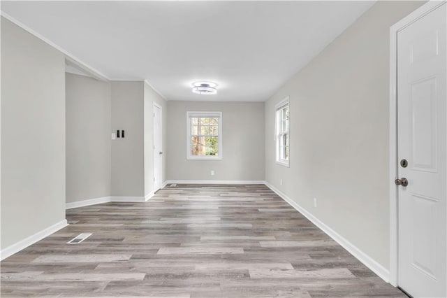 spare room featuring light hardwood / wood-style flooring