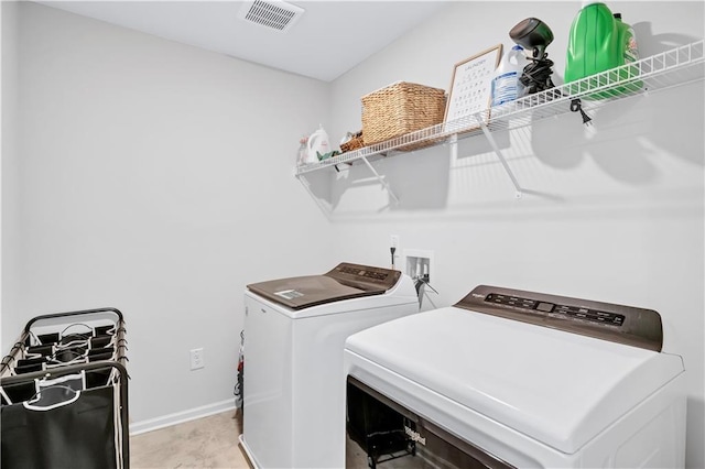 4658 Electric Ave SW, Mableton, GA 30126 - laundry room with laundry area, washer and clothes dryer, baseboards, and visible vents