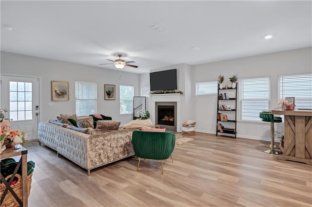 4658 Electric Ave SW, Mableton, GA 30126 - living room featuring a ceiling fan, a fireplace, baseboards, recessed lighting, and light wood-style flooring