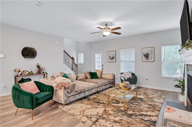 4658 Electric Ave SW, Mableton, GA 30126 - living area with visible vents, a healthy amount of sunlight, stairway, and wood finished floors