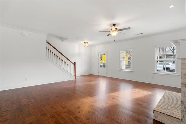 unfurnished living room with dark hardwood / wood-style flooring, ceiling fan, crown molding, and a fireplace