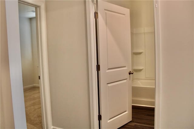 hall featuring dark wood-type flooring