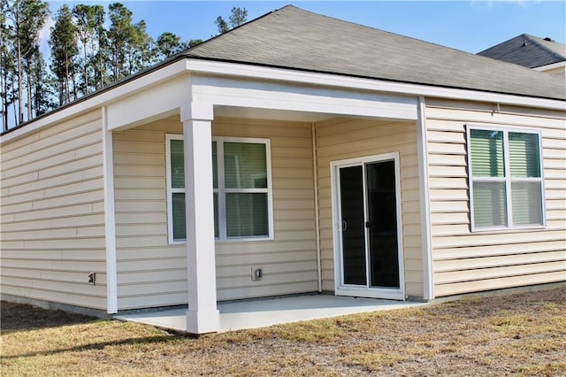 rear view of property featuring a patio area