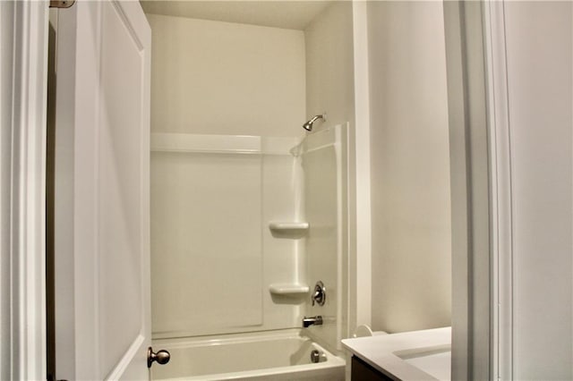 bathroom featuring shower / washtub combination and vanity