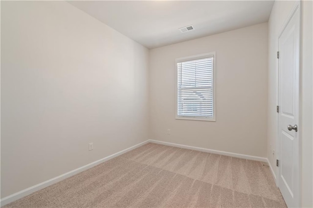 empty room featuring light colored carpet