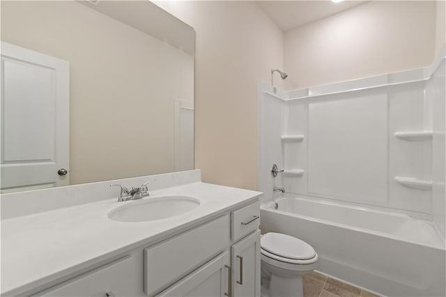 full bathroom featuring toilet, tile patterned flooring, vanity, and washtub / shower combination