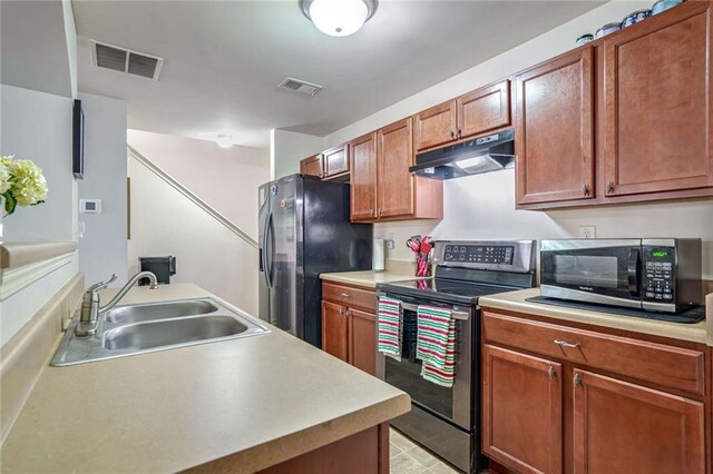 kitchen featuring stainless steel appliances and sink