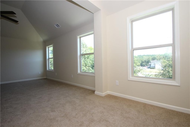 bonus room featuring ceiling fan, light colored carpet, and vaulted ceiling