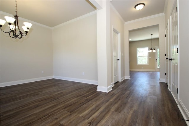 interior space featuring dark hardwood / wood-style flooring, ornamental molding, and a chandelier