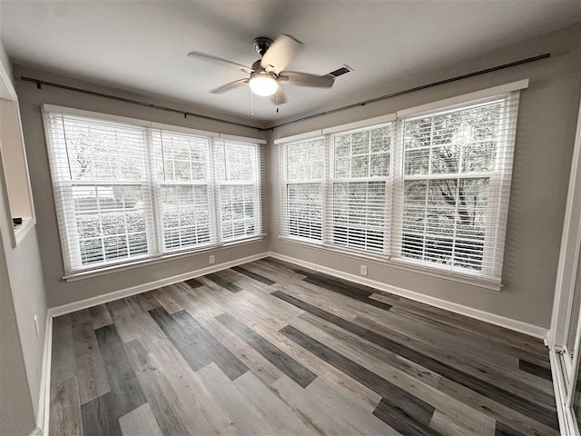 interior space with plenty of natural light and ceiling fan