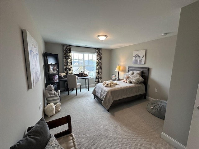 carpeted bedroom with baseboards