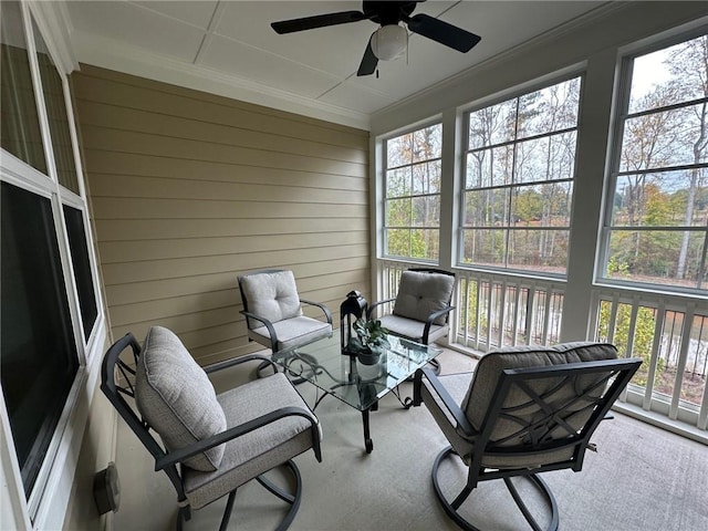 sunroom featuring a ceiling fan