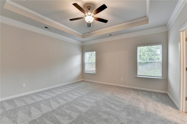 1431 Winding Ridge Trl, Buford, GA 30548 - empty room with a raised ceiling, crown molding, plenty of natural light, carpet flooring, and ceiling fan