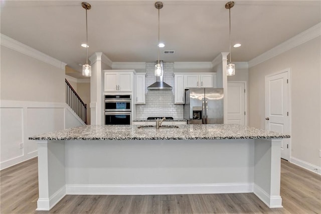 1431 Winding Ridge Trl, Buford, GA 30548 - kitchen featuring stainless steel appliances, ornamental molding, wall chimney exhaust hood, decorative backsplash, and light stone counters