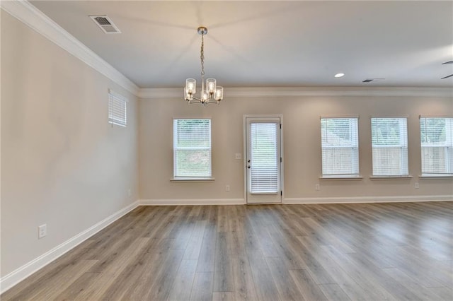 1431 Winding Ridge Trl, Buford, GA 30548 - unfurnished dining area with crown molding, a chandelier, wood finished floors, and recessed lighting