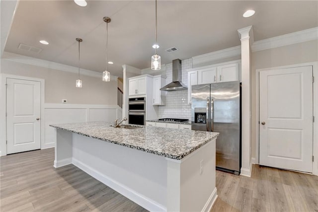 1431 Winding Ridge Trl, Buford, GA 30548 - kitchen featuring wall chimney exhaust hood, appliances with stainless steel finishes, crown molding, decorative backsplash, and white cabinets