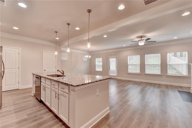 1431 Winding Ridge Trl, Buford, GA 30548 - kitchen with stainless steel dishwasher, a ceiling fan, an island with sink, light wood-type flooring, and crown molding