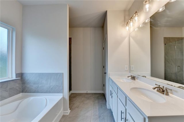 1431 Winding Ridge Trl, Buford, GA 30548 - bathroom featuring plenty of natural light, a garden tub, double vanity, and a stall shower