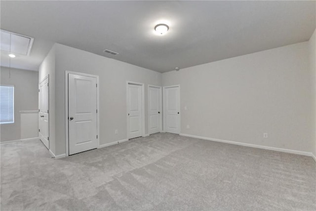 1431 Winding Ridge Trl, Buford, GA 30548 - unfurnished bedroom with attic access, carpet flooring, and multiple closets