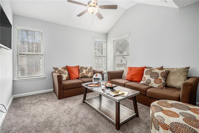 living area with lofted ceiling, carpet flooring, ceiling fan, and baseboards