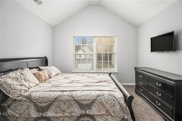 carpeted bedroom with baseboards, visible vents, and vaulted ceiling