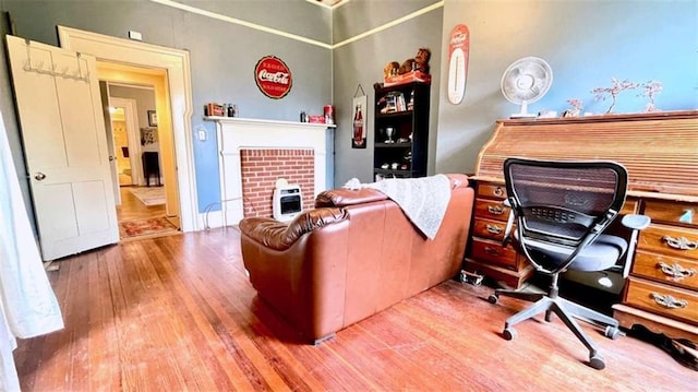 office area featuring wood finished floors and heating unit