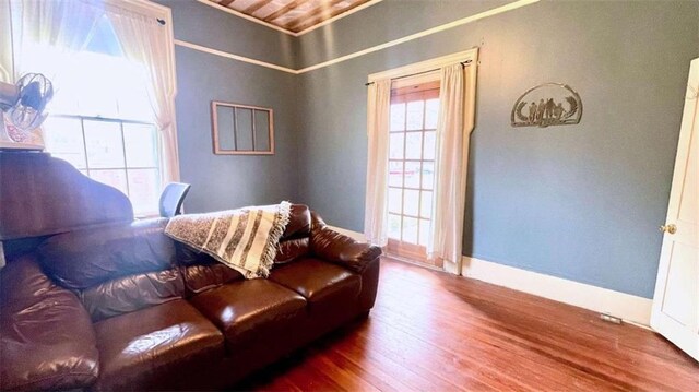 living room with wood finished floors and baseboards