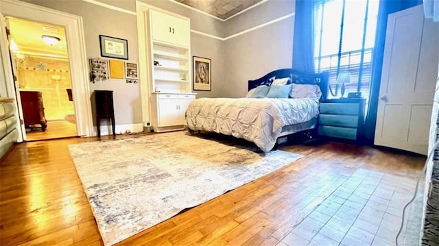 bedroom featuring wood-type flooring