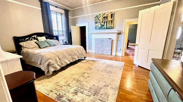 bedroom featuring wood finished floors and baseboards