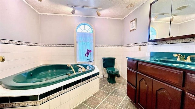full bath featuring a textured ceiling, rail lighting, tile patterned flooring, ornamental molding, and vanity