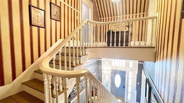 stairway with wallpapered walls