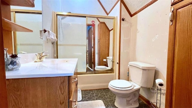 full bath featuring toilet, vanity, bath / shower combo with glass door, and tile patterned floors