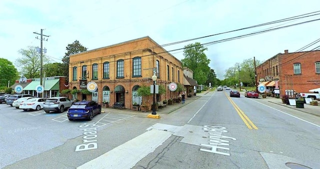 view of asphalt street with sidewalks