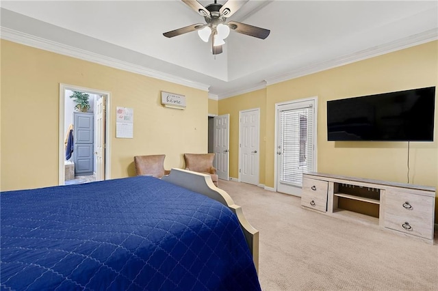 bedroom with a tray ceiling, ornamental molding, a ceiling fan, carpet flooring, and baseboards