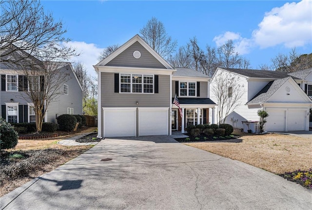 traditional-style home with a garage and concrete driveway