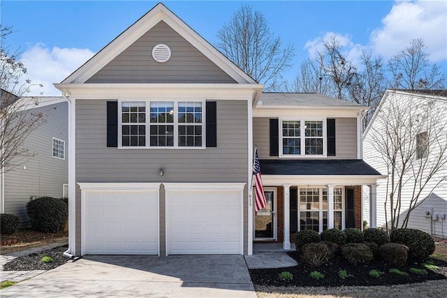 traditional-style home with brick siding, concrete driveway, covered porch, and a garage