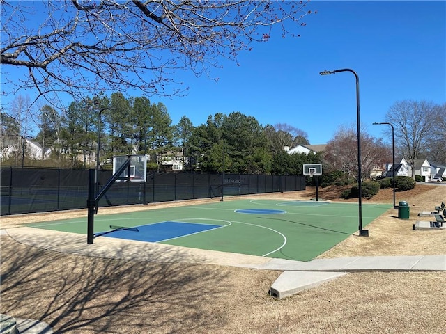 view of sport court featuring community basketball court and fence