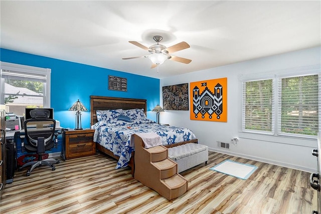 bedroom featuring ceiling fan and light hardwood / wood-style flooring