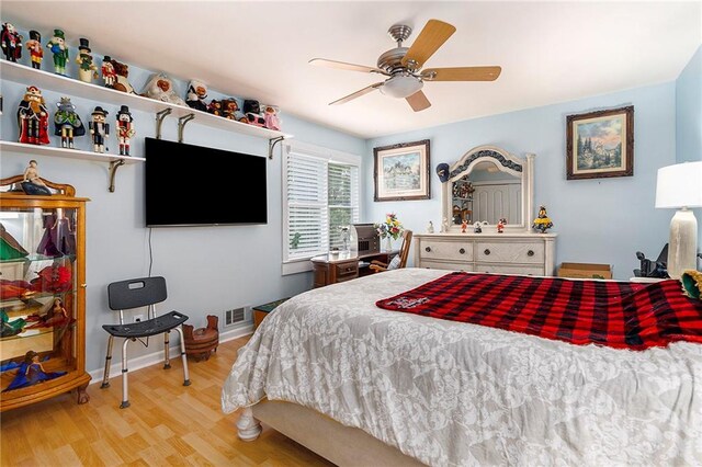 bedroom with ceiling fan and light hardwood / wood-style flooring