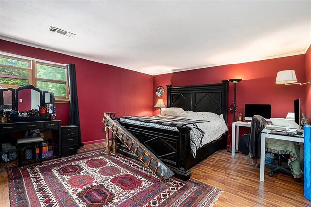 bedroom featuring hardwood / wood-style flooring