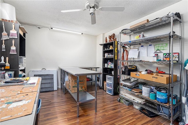 office area with a textured ceiling, dark hardwood / wood-style floors, and ceiling fan