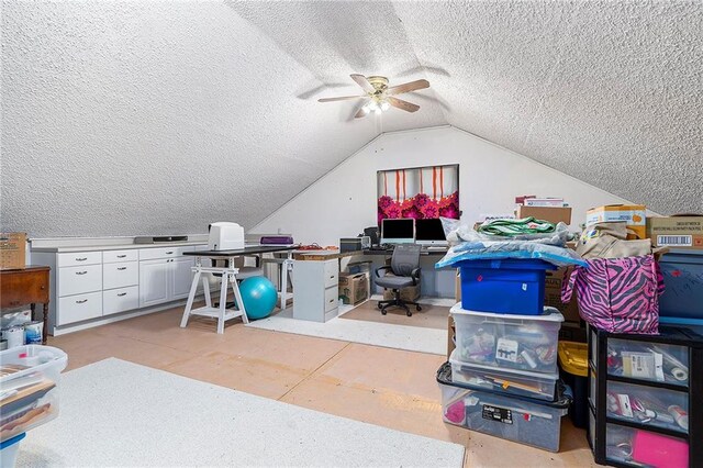 office space with ceiling fan, a textured ceiling, and vaulted ceiling