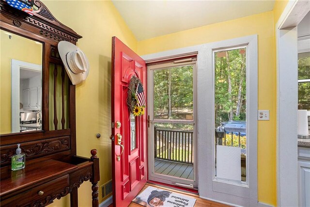 foyer entrance with hardwood / wood-style flooring