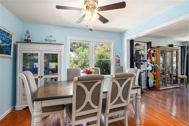 dining area featuring ceiling fan and wood-type flooring