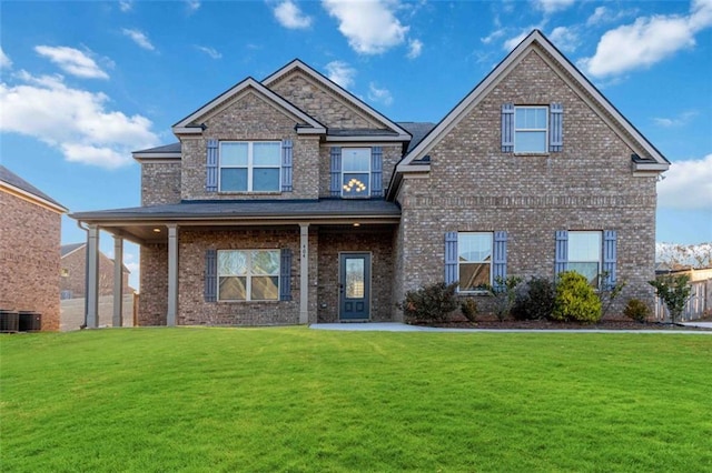 view of front of house featuring central AC unit and a front lawn